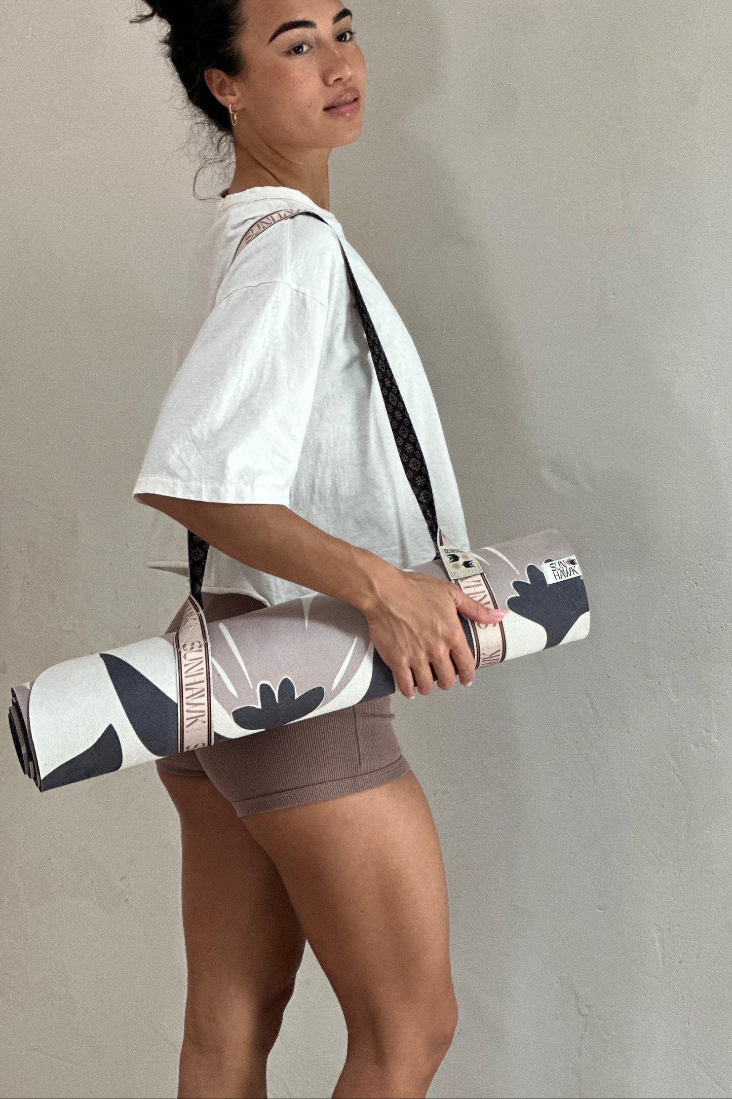 the Sunhawk logo yoga mat strap to help carry your mat