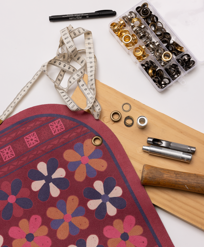 Crafting tools and materials used to add eyelet to hang your premium yoga mat.