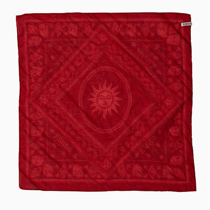 Red bandana with handrawn sun design and text.