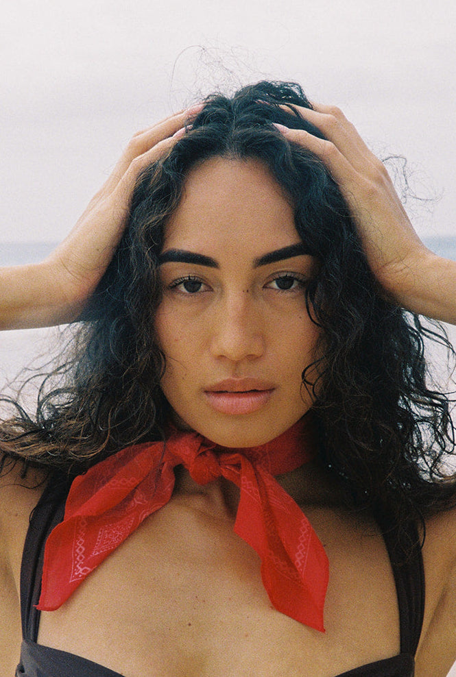 Woman wearing a red bandana